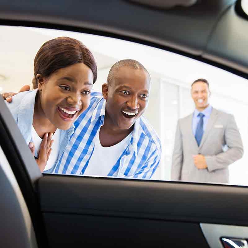 Plattner's Quincy Chevrolet GMC in QUINCY FL customers looking in new car